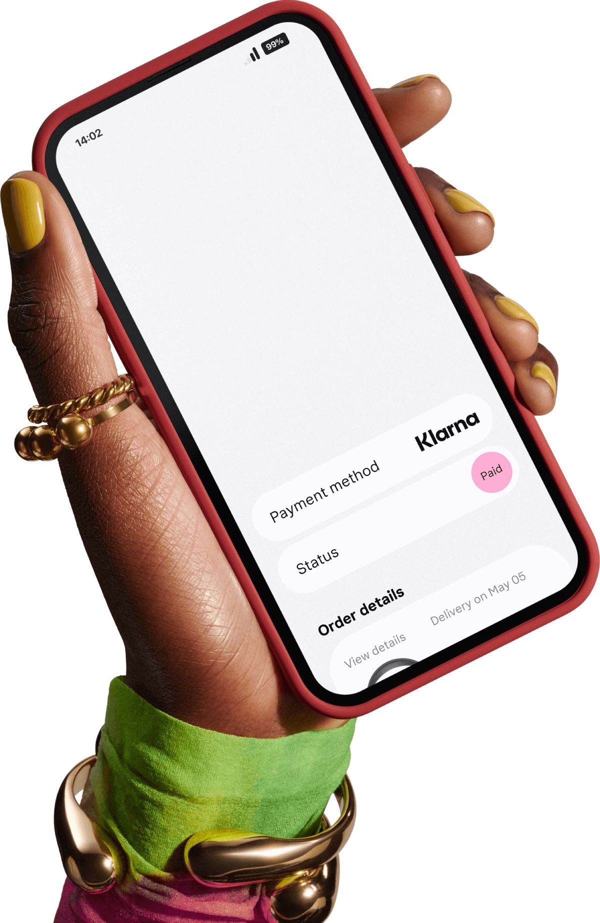 Hand with gold jewellery holding a phone